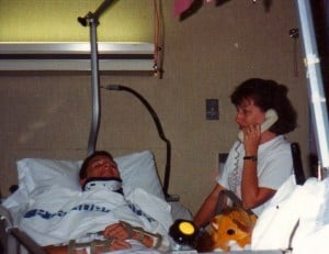 Michael in hospital bed as mom answers the telephone